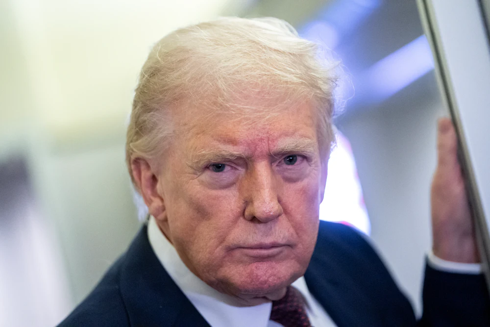 Donald Trump glares while standing on Air Force One