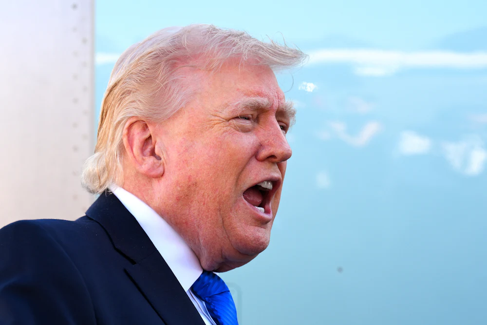 President Donald Trump spoke to reporters before boarding Air Force One at Palm Beach International Airport on March 23, 2026.