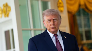 Donald Trump frowns while standing outside the Oval Office
