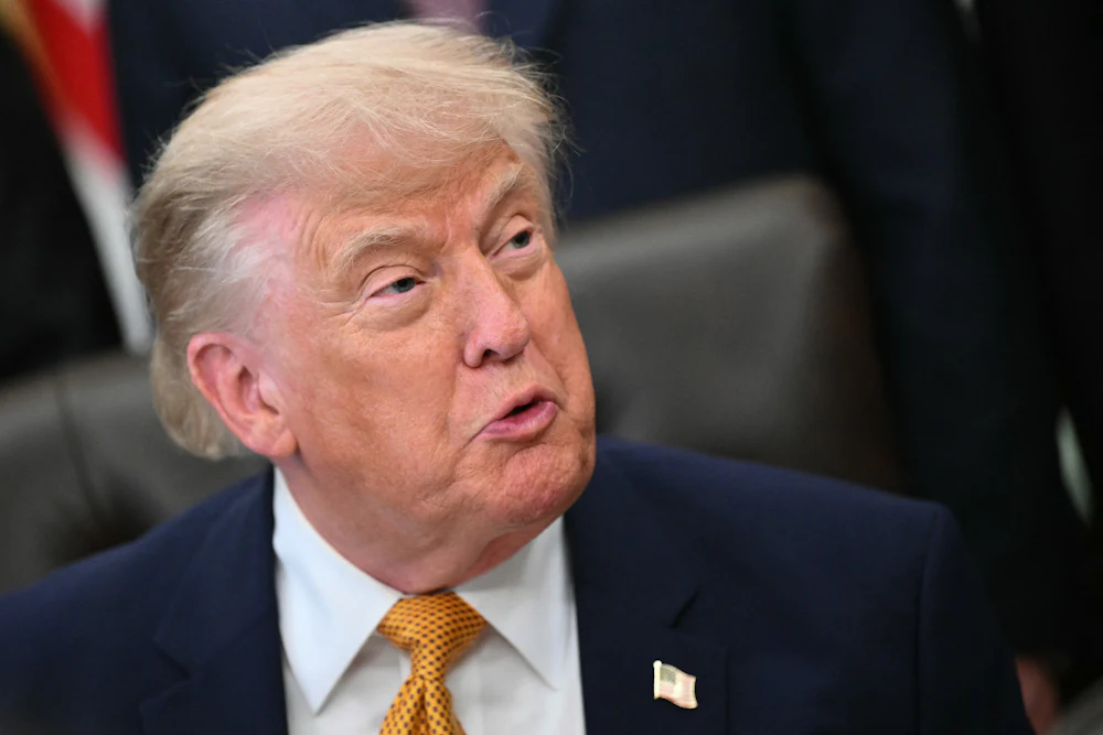 Donald Trump grimaces while looking to his left