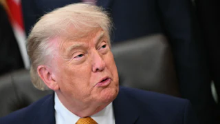 Donald Trump grimaces while looking to his left