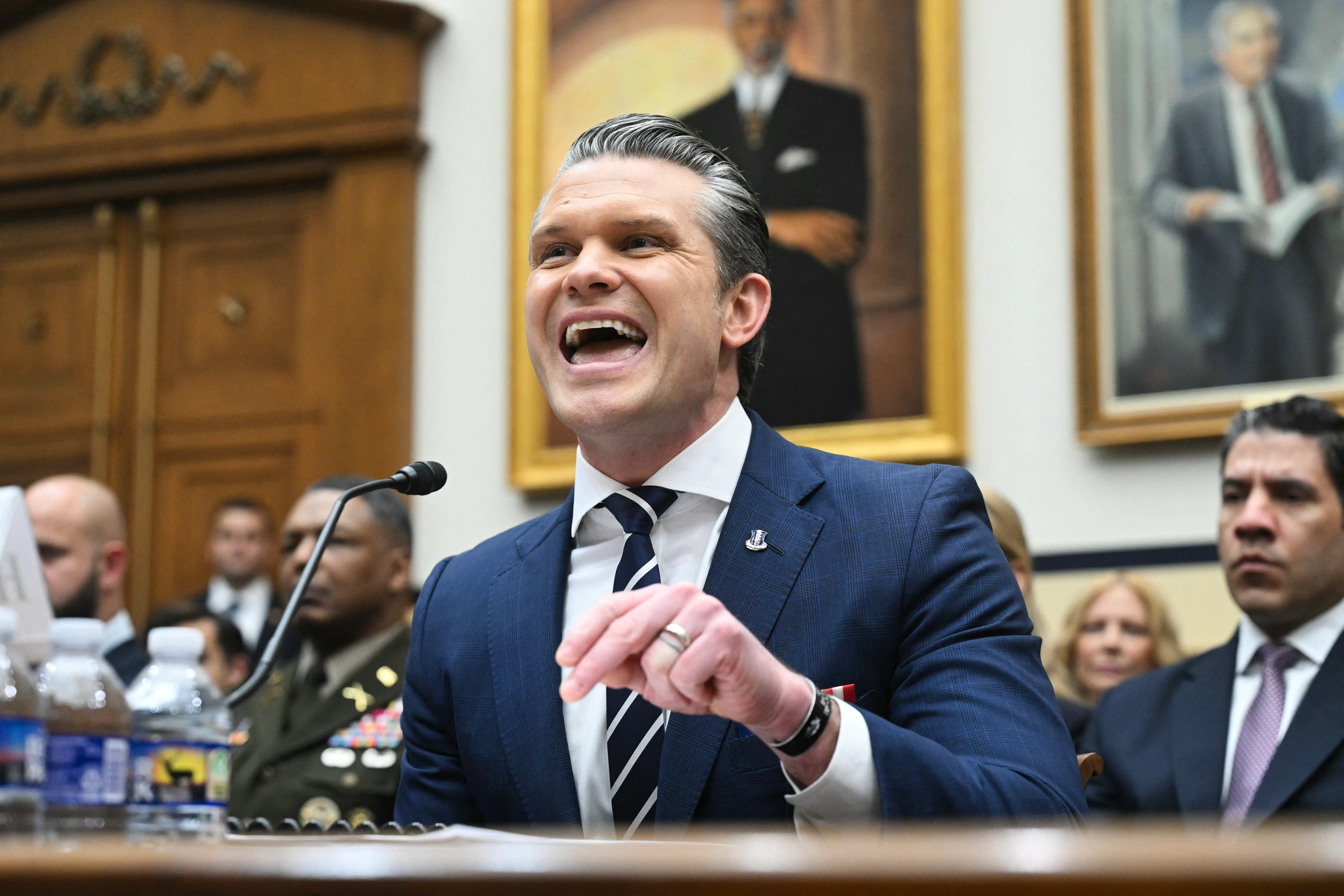 Defense Secretary Pete Hegseth testifies in Congress, speaking animatedly