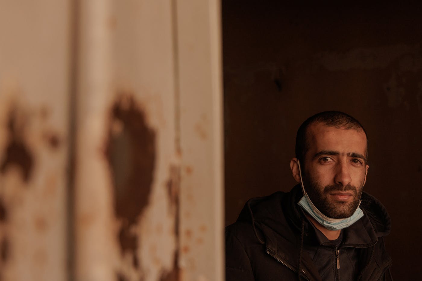 Bilal Al Haidad, from the southern town of Daraa, stands for a picture close to a cell entrance. Bilal, born in 1994, was imprisoned in 2019 and liberated on Sunday, Dec. 8, 2024, when rebel forces took over the prison. “There is nobody left from 2018 and before," he told The New Republic; everyone he knew that was in the prison then were "all killed.” 