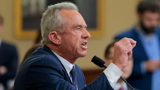 HHS Secretary Robert F. Kennedy Jr. points and yells angrily in a congressional hearing