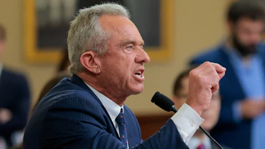 HHS Secretary Robert F. Kennedy Jr. points and yells angrily in a congressional hearing