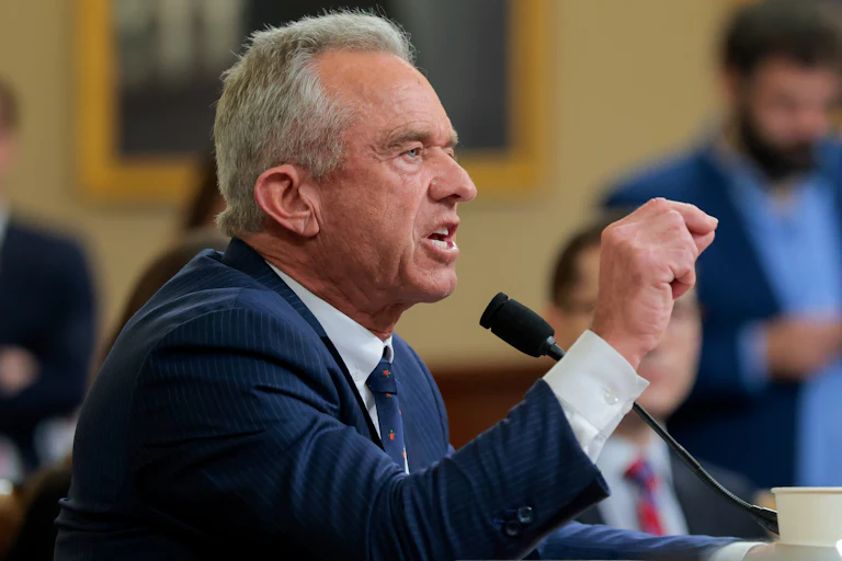 HHS Secretary Robert F. Kennedy Jr. points and yells angrily in a congressional hearing