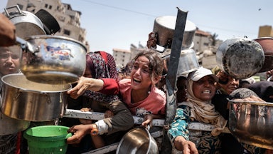 A charity distributes meals to Palestinians in Gaza City on July 28.