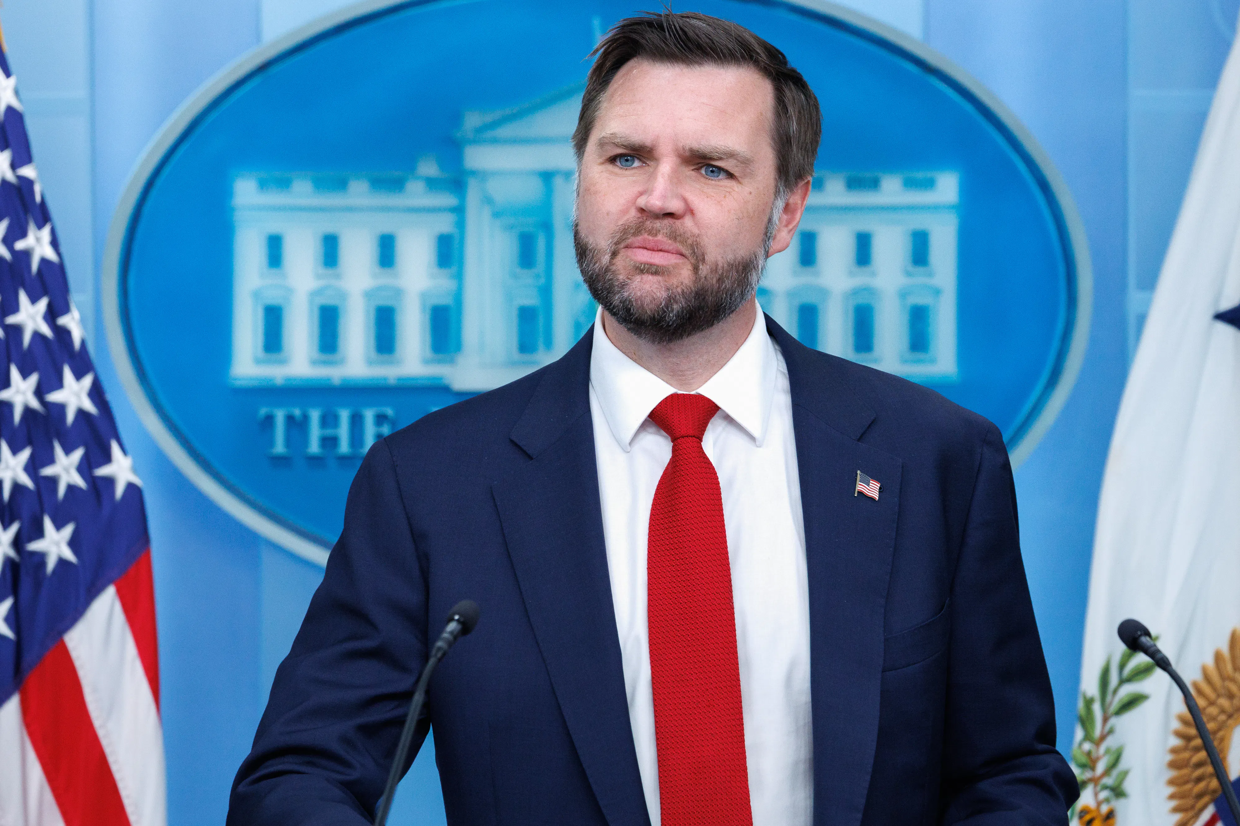 JD Vance stands at the podium in the White House Press Briefing Room.