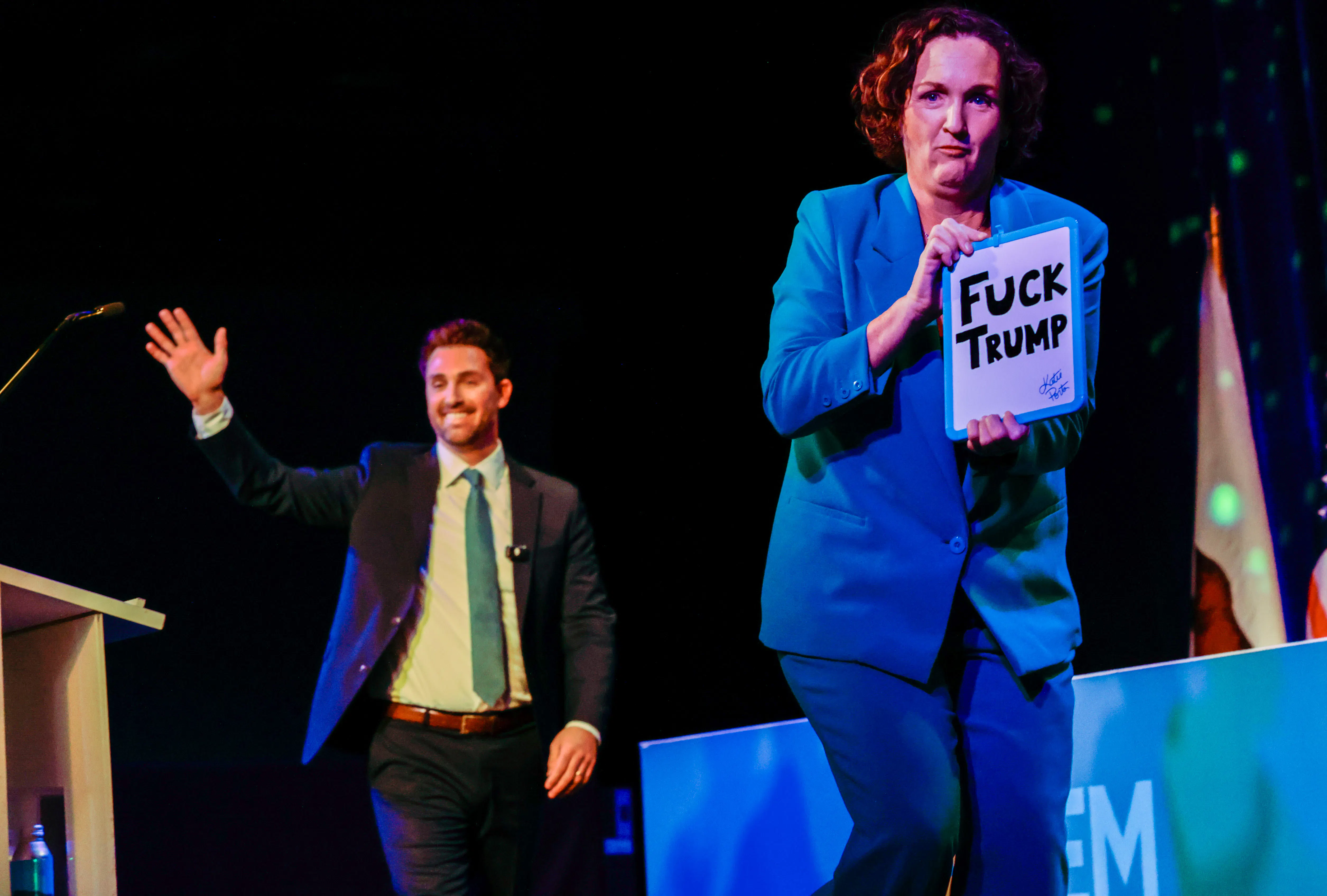 Gubernatorial candidate Katie Porter exits as fellow candidate Ian Calderon enters the stage 