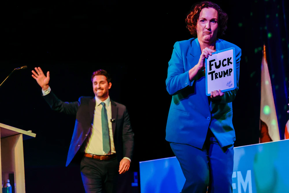 Gubernatorial candidate Katie Porter exits as fellow candidate Ian Calderon enters the stage