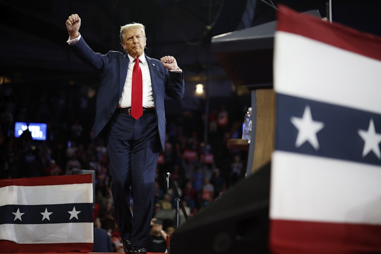 Donald Trump dances on stage at a campaign event