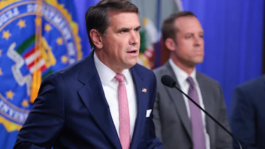 Acting Attorney General Todd Blanche speaks at a podium