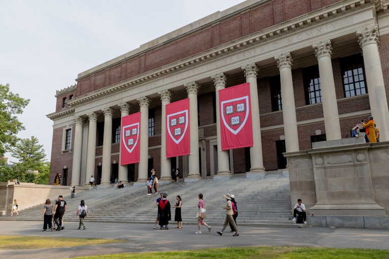People walk on Harvard University's campus.