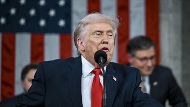 Aliya Rahman is surrounded people trying to escort her out of Tru