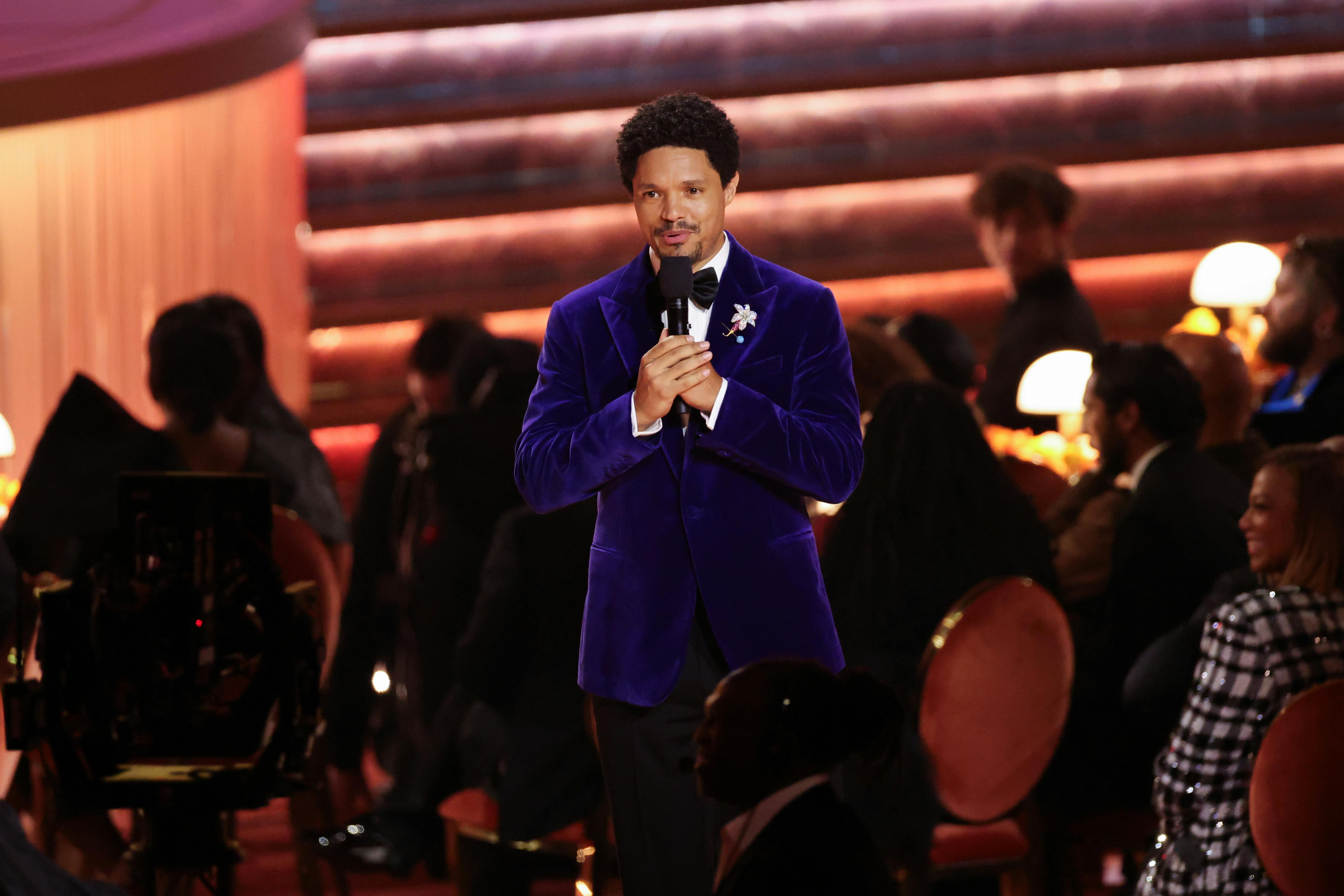 Trevor Noah speaks while hosting the Grammys