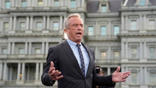Robert F. Kennedy Jr. gestures while speaking outside to reporters