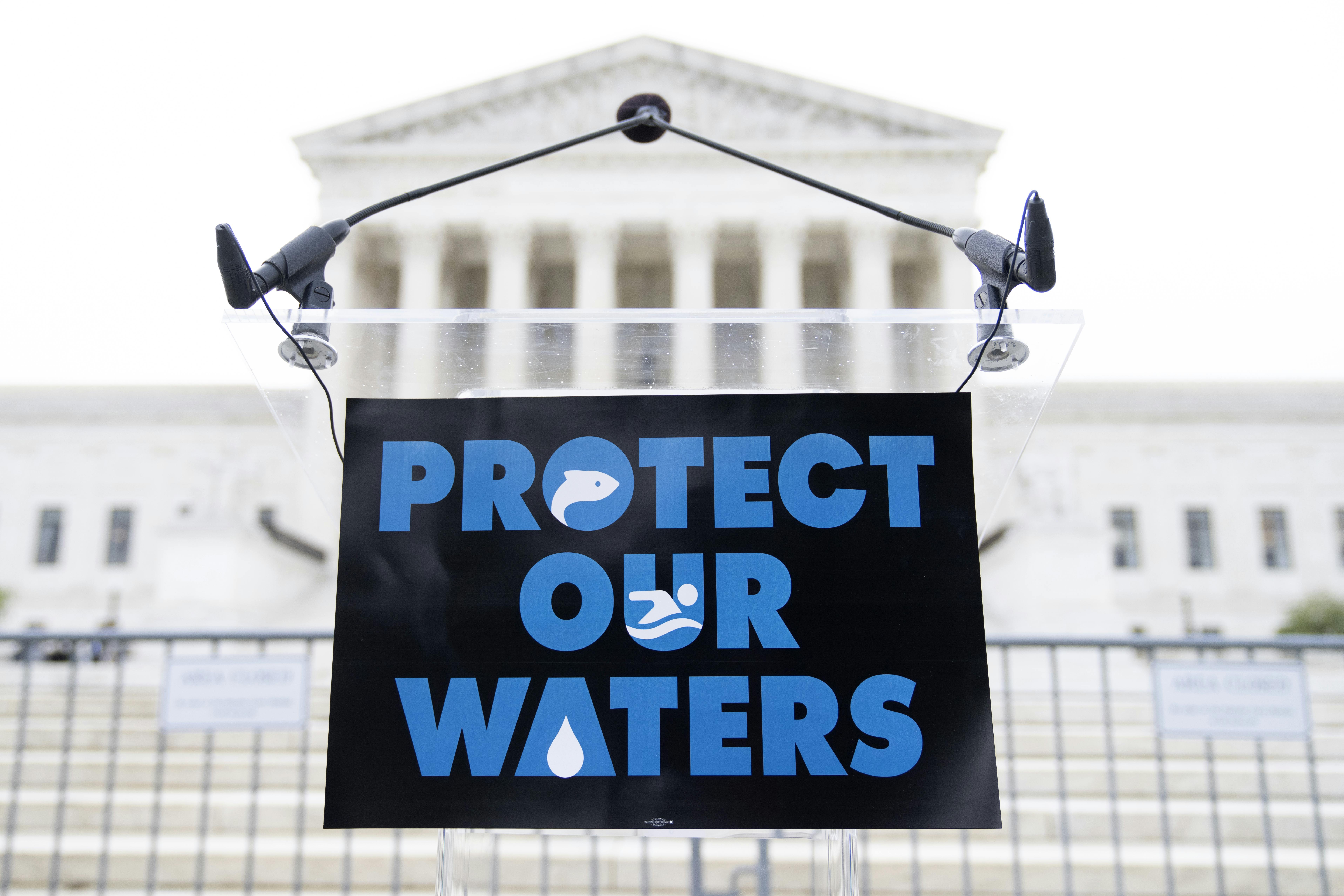 A sign is seen before a rally to call for protection of the Clean Water Act, outside of the U.S. Supreme Court.