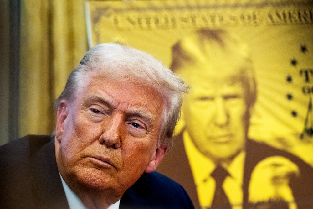 Trump during the signing of an executive order establishing the “Trump Gold Card”