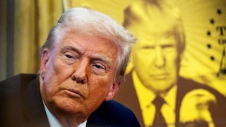 Trump during the signing of an executive order establishing the “Trump Gold Card”