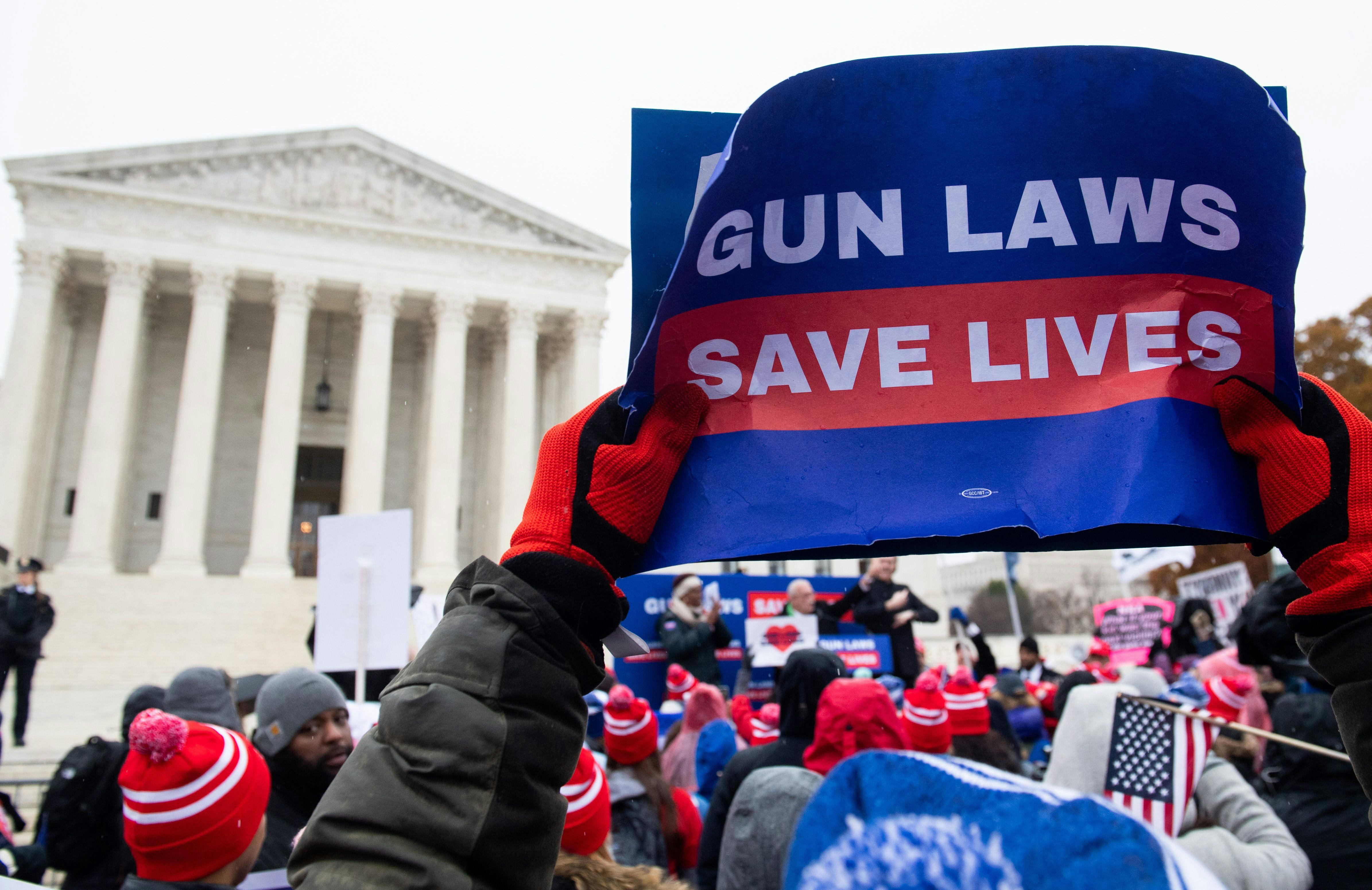 Supporters of gun control and firearm safety measures hold a protest rally outside the Supreme Court during oral arguments in State Rifle and Pistol v. City of New York, NY, on December 2, 2019. 