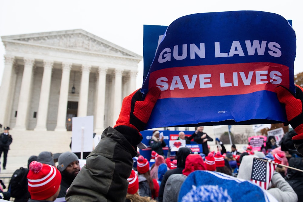 Supporters of gun control and firearm safety measures hold a protest rally outside the Supreme Court during oral arguments in State Rifle and Pistol v. City of New York, NY, on December 2, 2019.