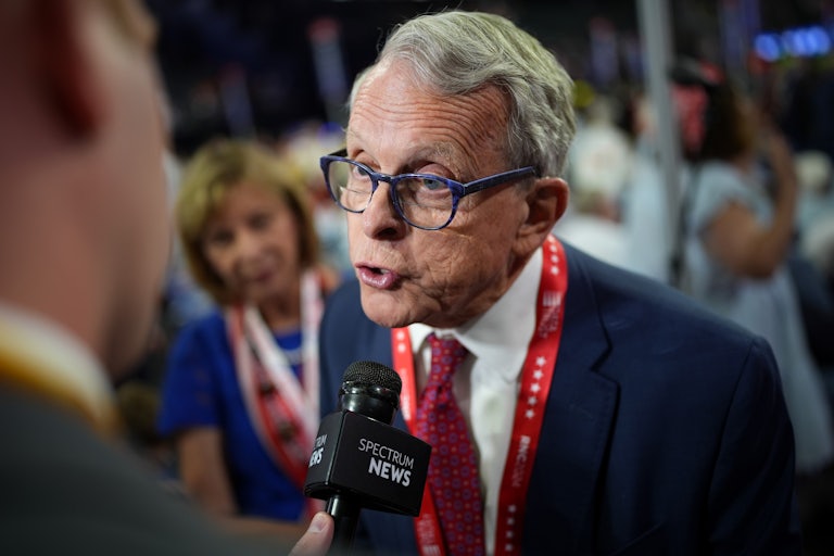 Ohio Governor Mike DeWine speaks to a reporter at the Republican National Convention