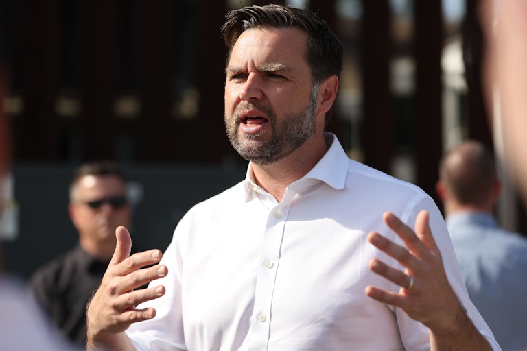 J.D. Vance speaks and makes gestures with his hands