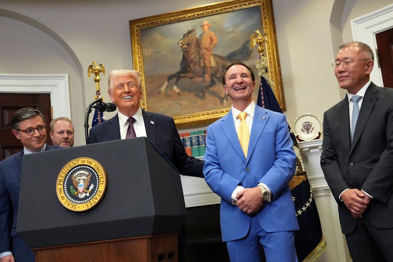 Donald Trump and Lousiana Governor Jeff Landry laugh in the Oval Office of the White House, along with others.