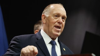 White House border czar Tom Homan speaks at a podium while making a hand gesture for emphasis