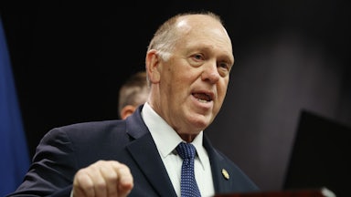 White House border czar Tom Homan speaks at a podium while making a hand gesture for emphasis