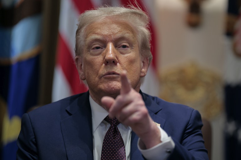 President Donald Trump sits in the Oval Office.