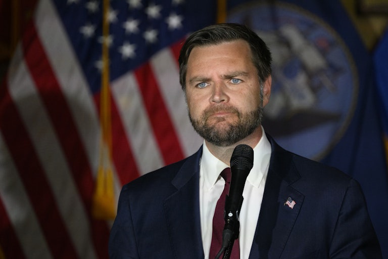 J.D. Vance frowns during a campaign event for Donald Trump