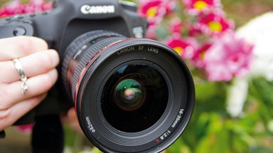 A person holds a camera