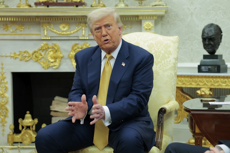 Donald Trump speaks in the gold-filled Oval Office of the White House.