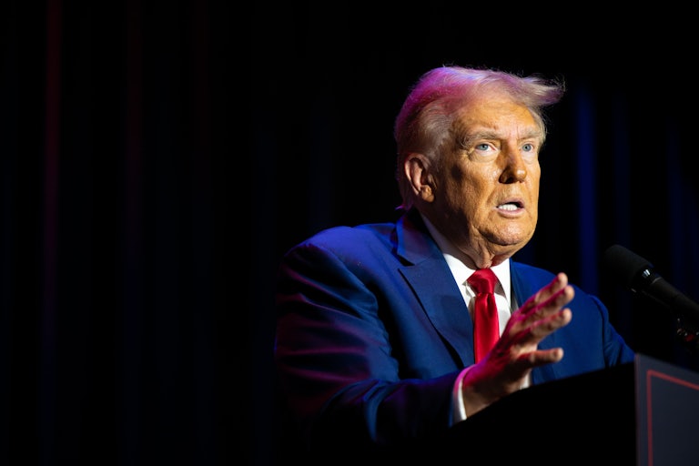 Donald Trump looks panicked while speaking at a lectern