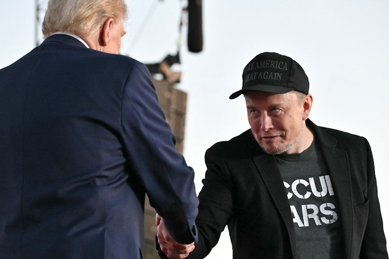 Elon Musk creepily bows to Donald Trump and shakes his hand