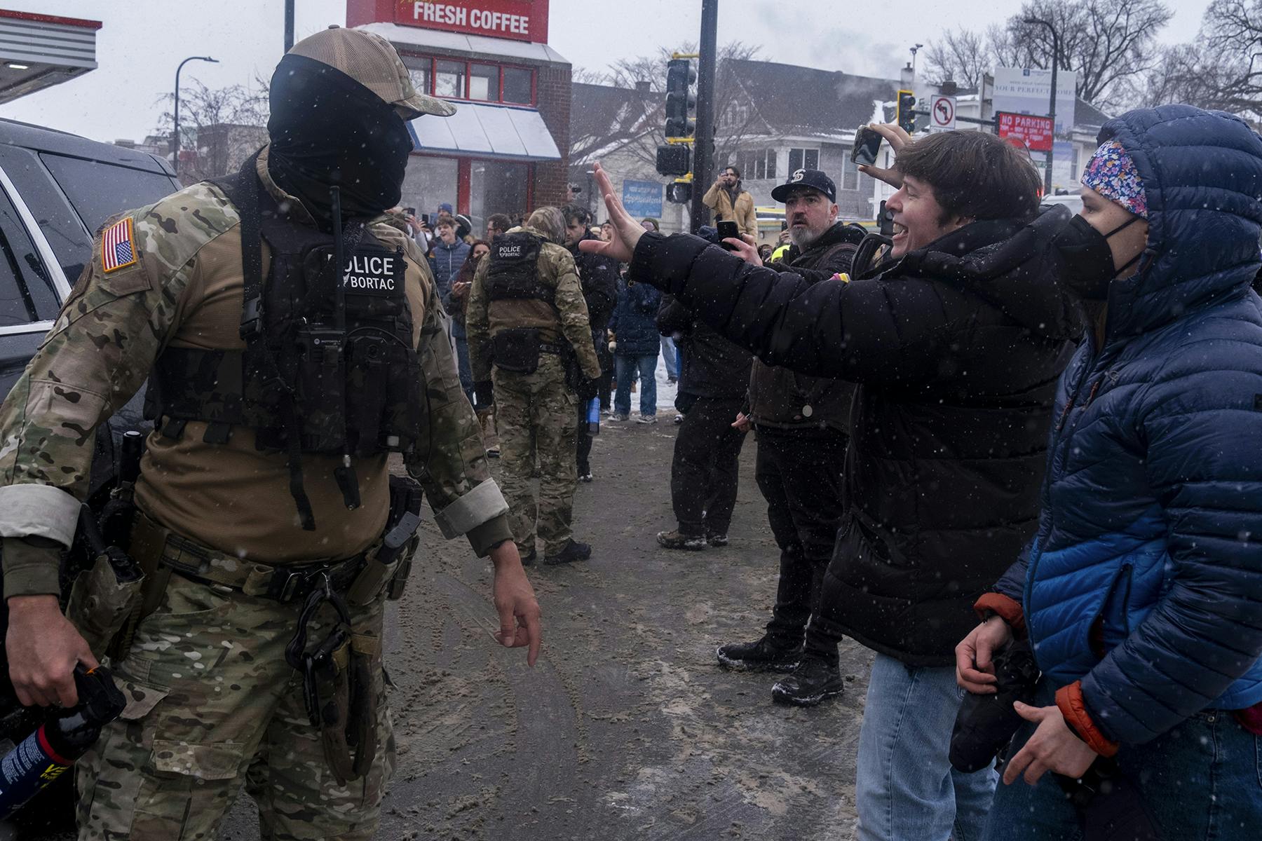 Protesters recording ICE agents in Minneapolis, Minnesota on January 21, 2026.