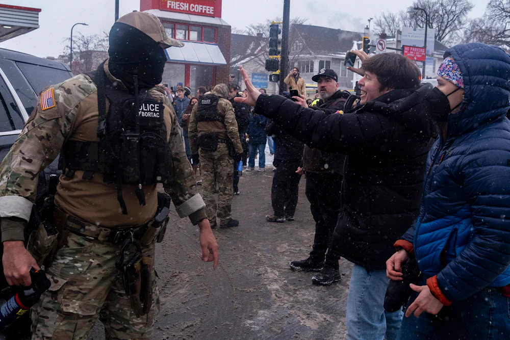 Protesters recording ICE agents in Minneapolis, Minnesota on January 21, 2026.