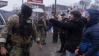 Protesters recording ICE agents in Minneapolis, Minnesota on January 21, 2026.