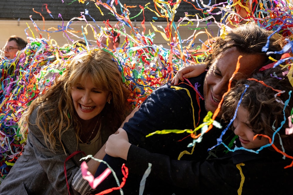 Confetti falling over the faces of Laura Dern, Will Arnett, and Calvin Knegten in Bradley Cooper’s “Is This Thing On?”