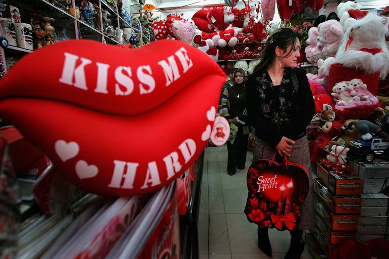 A woman shops a Valentine's Day display.