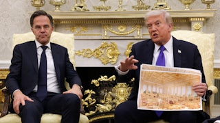 Trump holds an architectural rendering in front of a man who seems exasperated