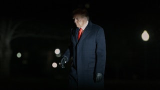 Donald Trump walks across the South Lawn of the White House.