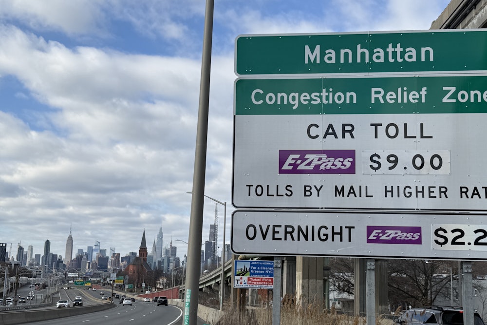 Congestion Relief Zone toll sign on the westbound Long Island Expressway approaching Van Dam Street in Queens, New York.