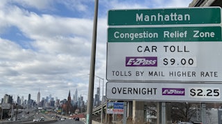 Congestion Relief Zone toll sign on the westbound Long Island Expressway approaching Van Dam Street in Queens, New York.