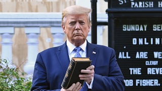 Donald Trump holding a bible.