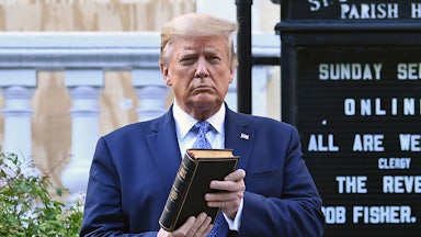 Donald Trump holding a bible.
