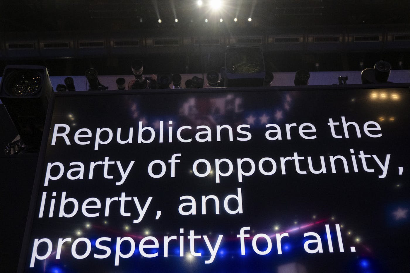 A giant screen displays the text Republicans are the party of oppoprtunity, liberty, and prosperity for all 