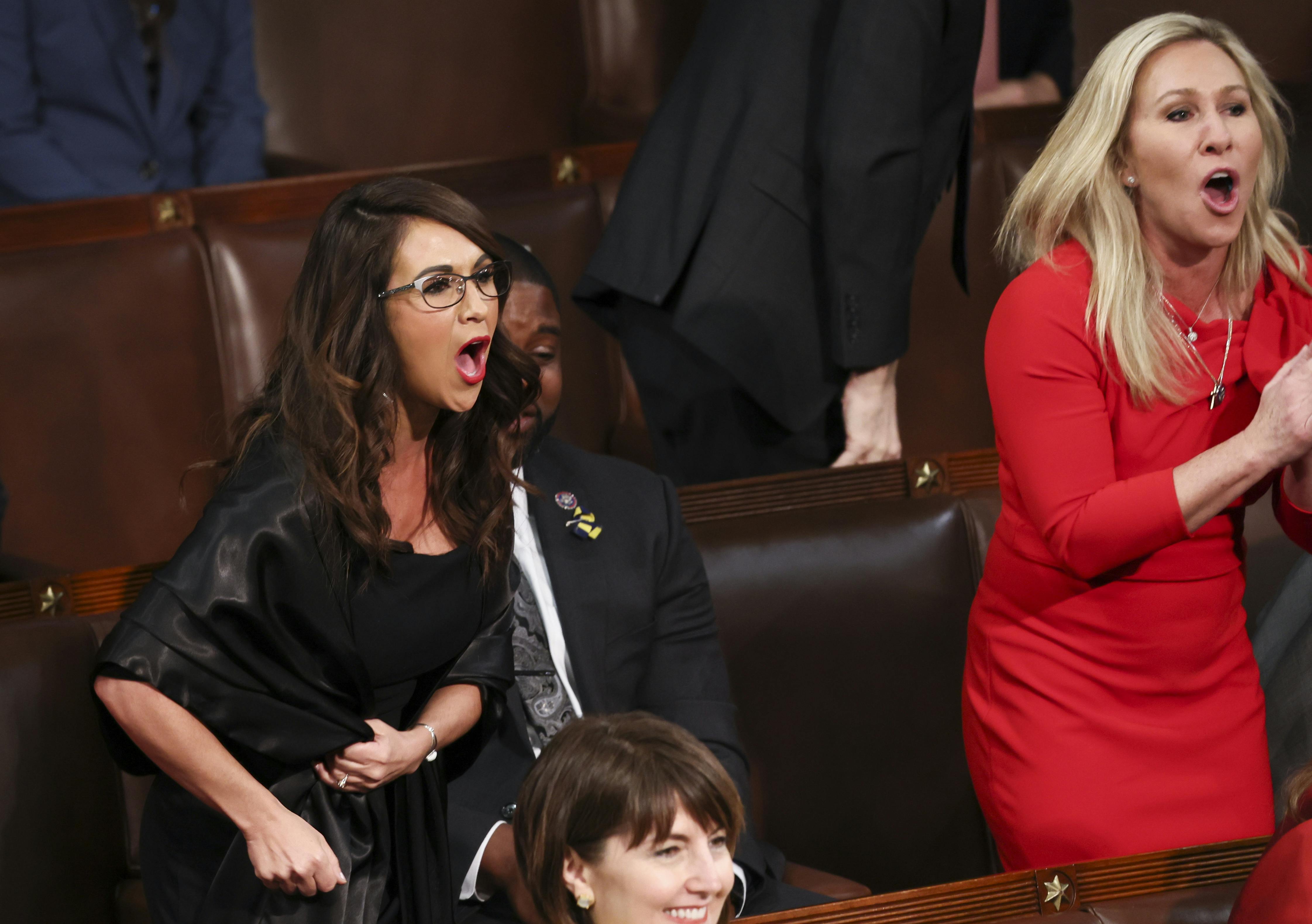 Representatives Lauren Boebert and Marjorie Taylor Greene shout at Biden