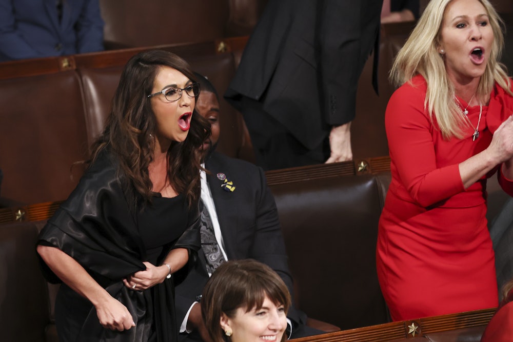 Representatives Lauren Boebert and Marjorie Taylor Greene shout at Biden